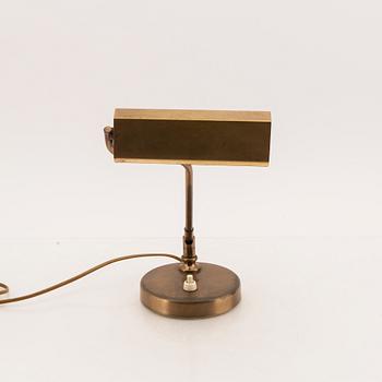 A 1950s Einar Bäckström brass table lamp.