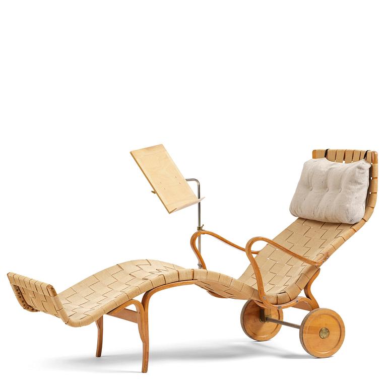 Bruno Mathsson, a lounge chair with wheels, Firma Karl Mathsson, Värnamo, 1940s, with reading table from 1972.