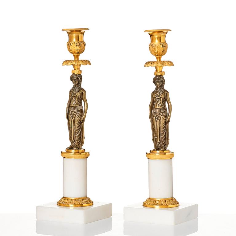 A pair of late Gustavian ormolu, patinated bronze, and marble candlessticks attributed to F. L. Rung (1758-1837).