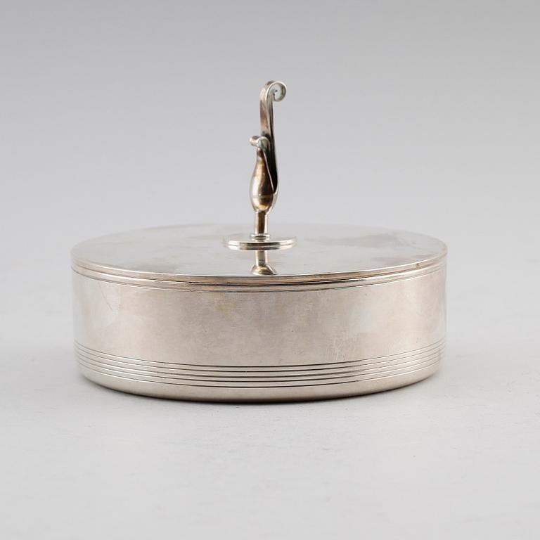 LOCKDOSA, silver, Tore Eldh, K&EC (K & E Carlson), Göteborg  1947. Vikt ca 167 gram.