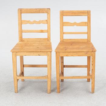 A gateleg table eith 6 + 6 chairs.