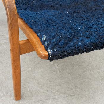 Yngve Ekström, a Swedese 'Lamino' armchair and foot-rest, Sweden, 2004.