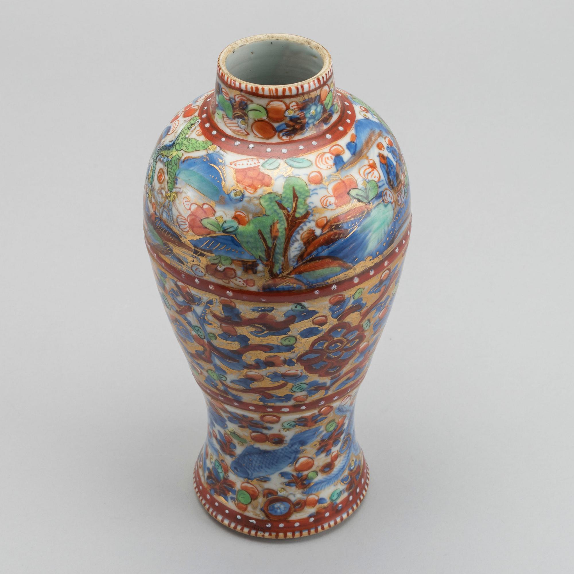 A Chinese clobbered 18th century porcelain vase, height ca 24 cm.