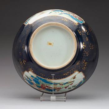 A powder blue and famille rose punch bowl, Qing dynasty, Qianlong (1736-95).