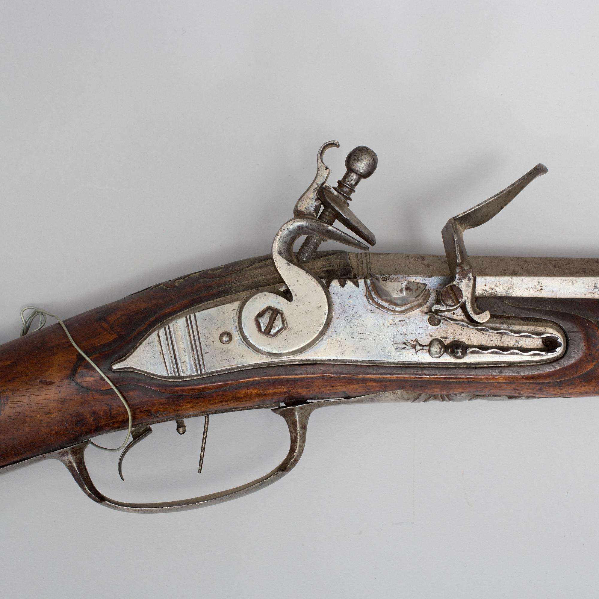 A 18th century flintlock rifle.