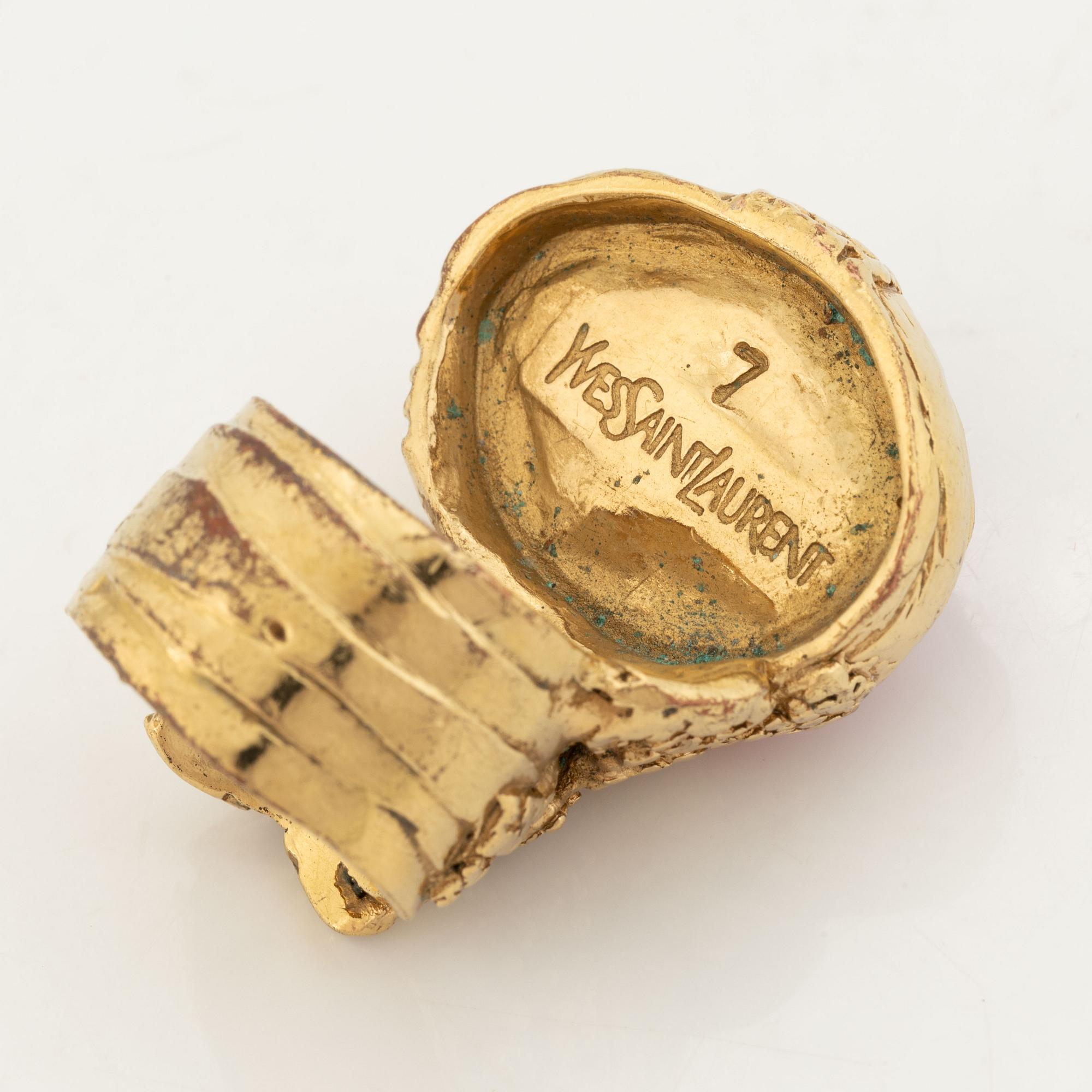 An Yves Saint Laurent ring.