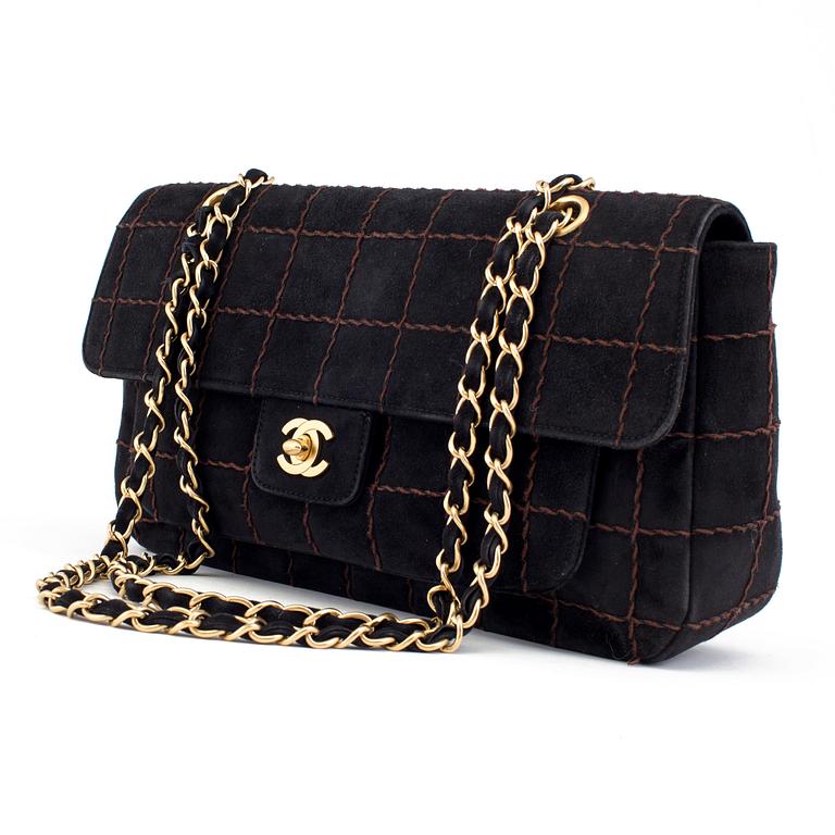 A CHOCO BAR SUEDE FLAP BAG BY CHANEL.