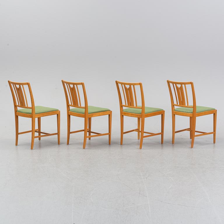 An oak dining table and four chairs by Carl Malmsten for Bodafors. Second half of the 20th Century.