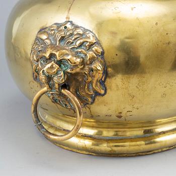 A 19th century brass champagne cooler.