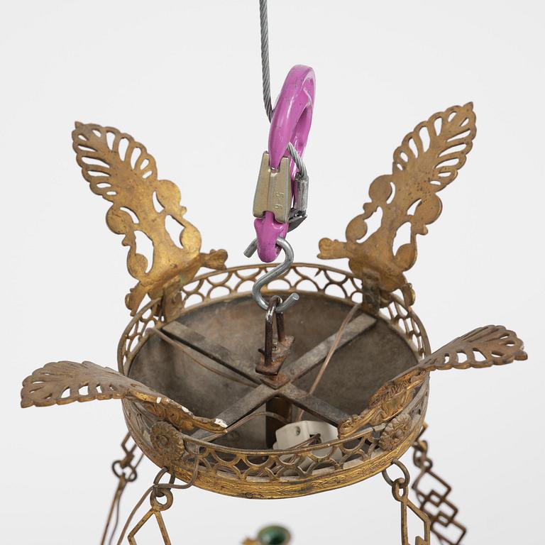 A presumably Russian Empire gilt and patinated bronze nine-branch chandelier, 19th century.