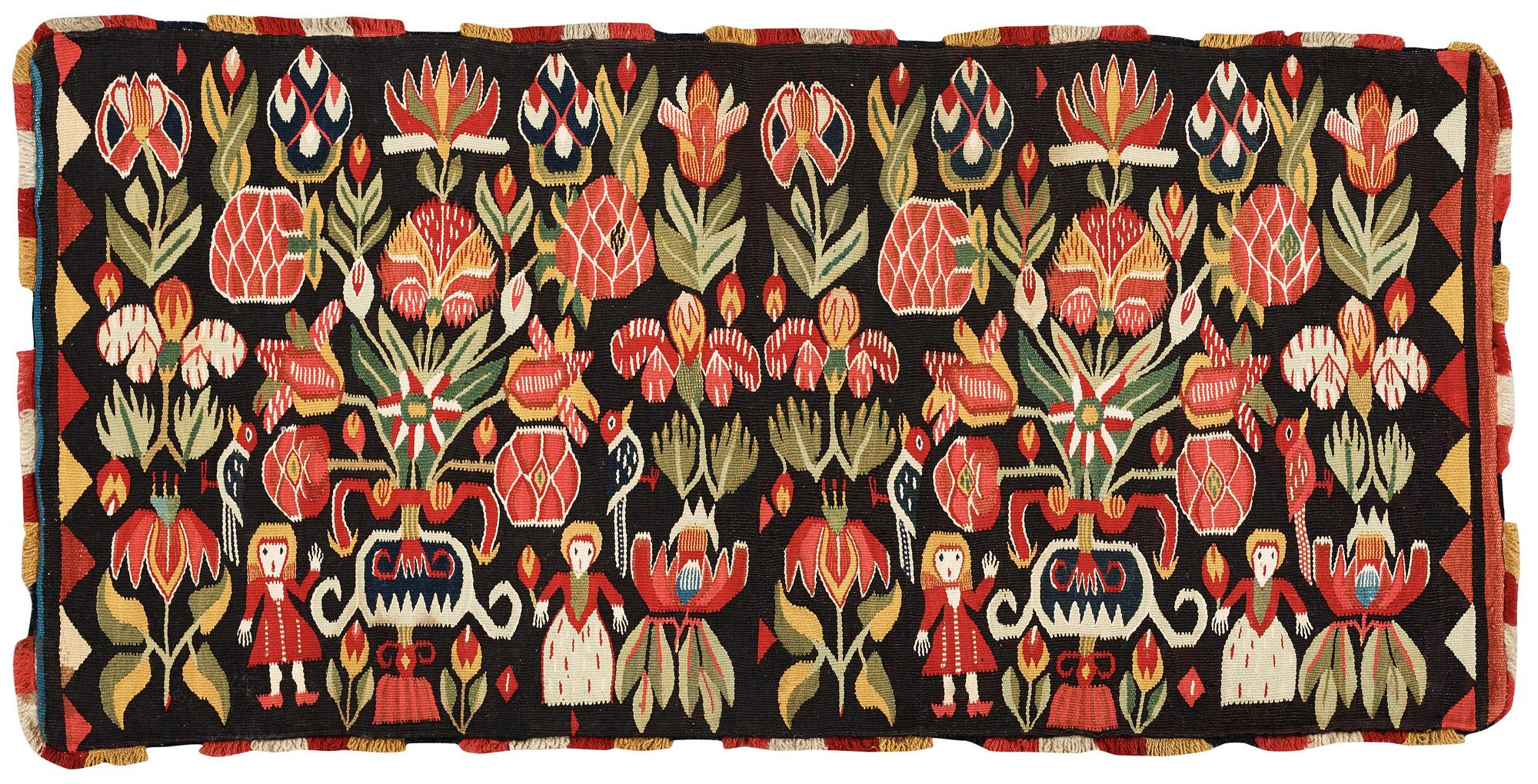 CARRIAGE CUSHION. Tapestry weave. "Urnor och par". 50,5 x 103 cm. Southern Scania, Sweden, 19th century.