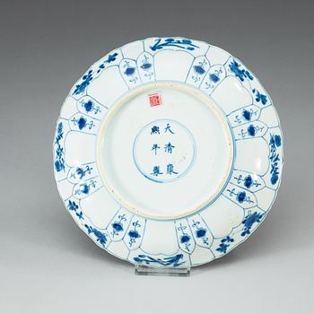 A blue and white dish, Qing dynasty, with Kangxi six character mark and of the period (1662-1722).