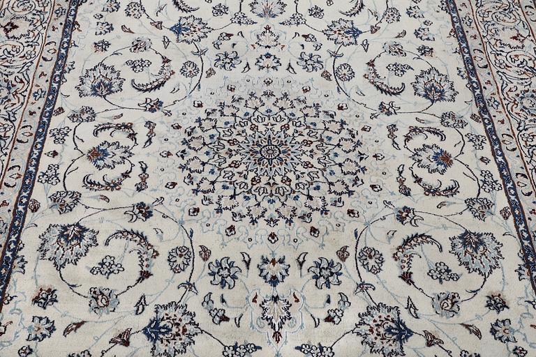 A Nain carpet, part silk, 6 laa, c. 294 x 193 cm.