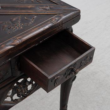 A Chinese hardwood games table, around the year 1900.