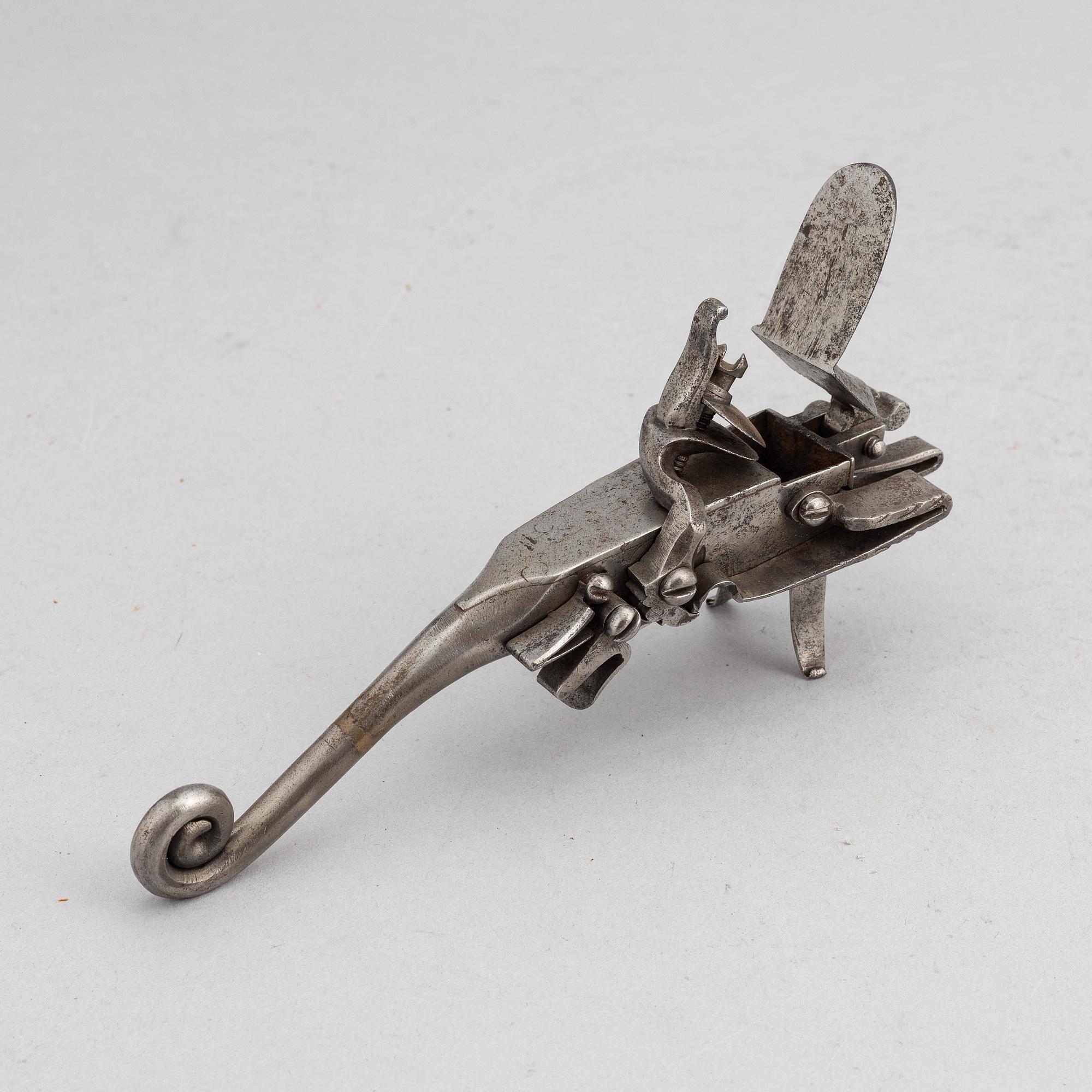 An 18th Century flintlock tinder lighter.