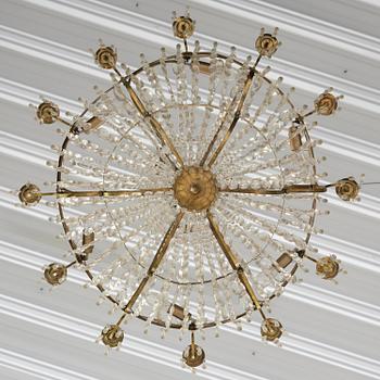 A Swedish gilt brass and cut glass thirteen-light Empire chandelier, early 19th century.