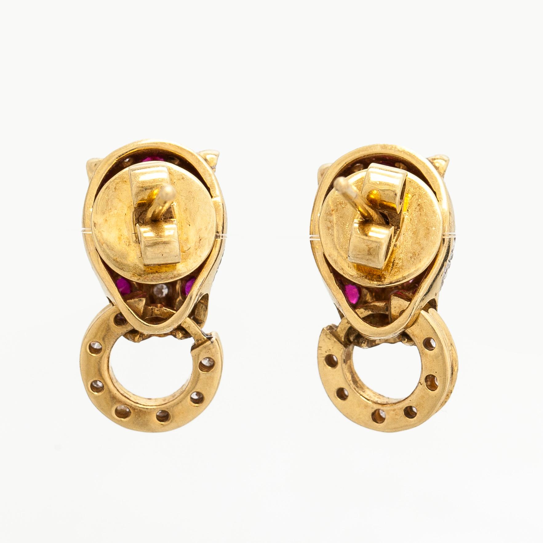 Korvakorut, 18K kultaa, rubiineja ja timantteja.