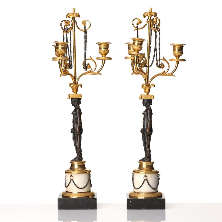 A pair of late Gustavian circa 1800 three-light candelabra, attributed to F L Rung.