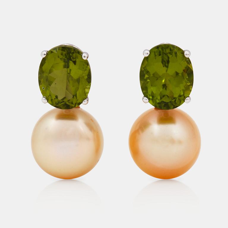 A pair of peridot and yellow cultured south sea pearl earrings.