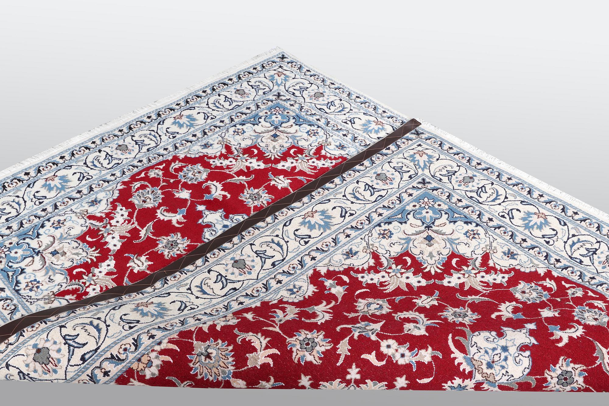 A carpet, Nain, part silk, ca 238 x 170 cm.
