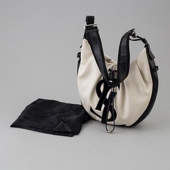 A vwite and black monogram hobobag by Yves Saint Laurent.