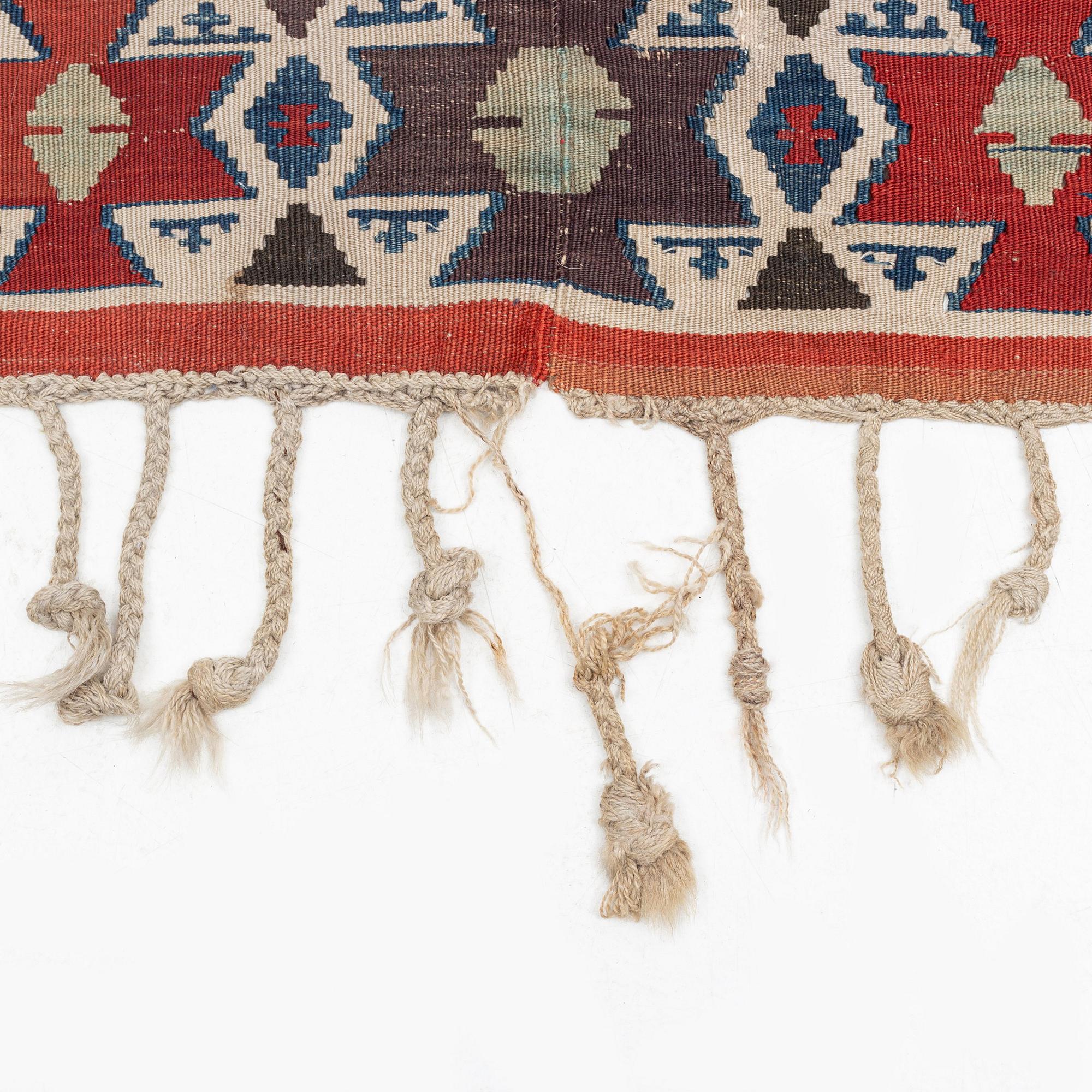 An antique Anatolian kilim, ca 324 x 169 cm.