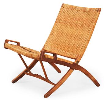 A Hans J Wegner oak and rattan folding chair, by Johannes Hansen, Denmark.