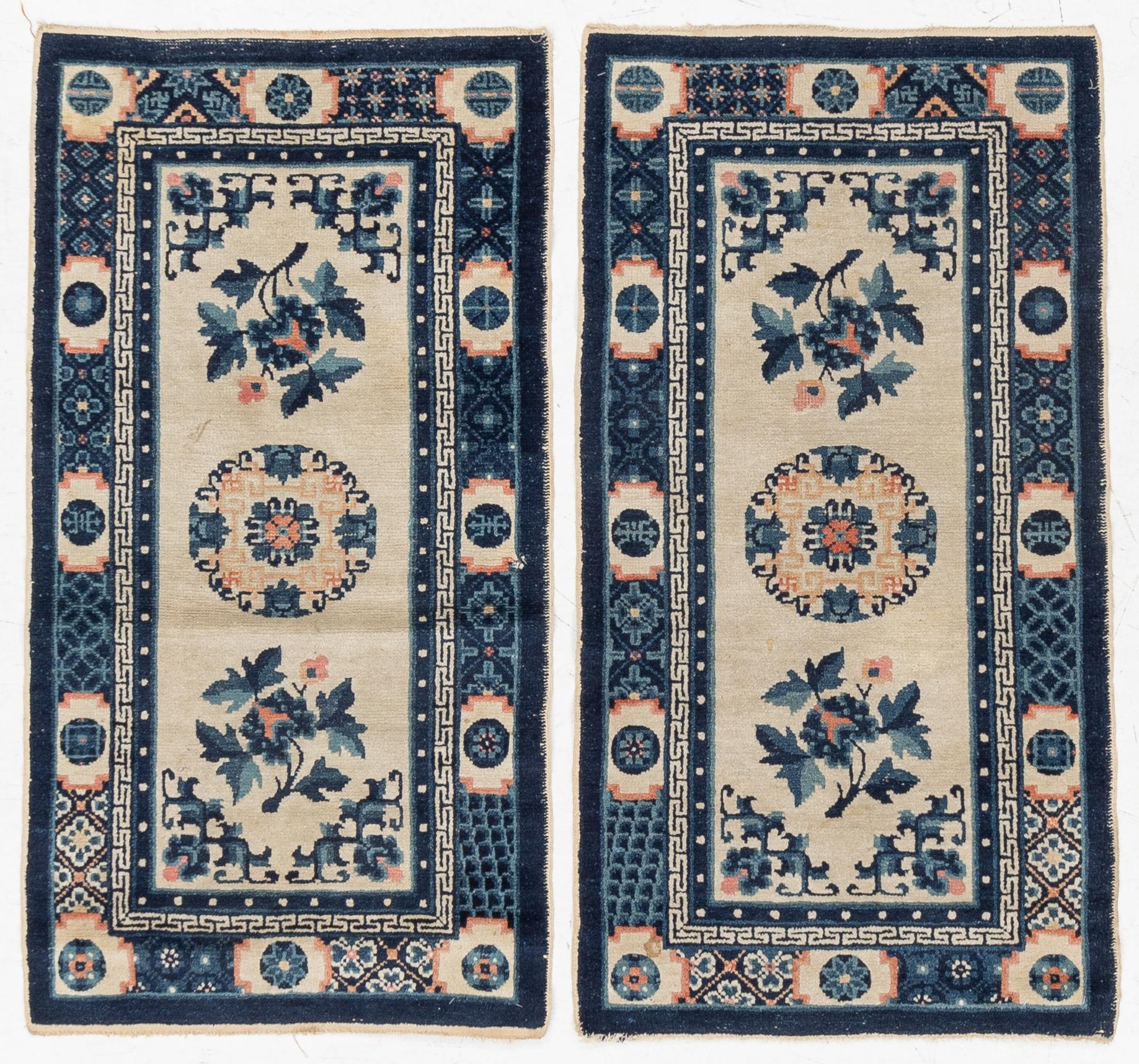 A pair of Baotou rugs, China, c. 120 x 64 cm.