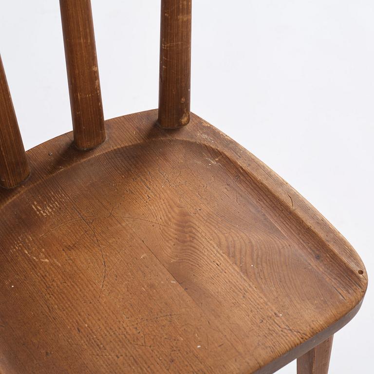 Axel Einar Hjorth, a set of four stained pine "Utö" chairs, Nordiska Kompaniet, Sweden 1930s.