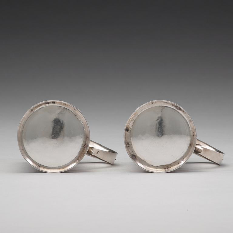 A pair of English early 18th century silver muggs, mark of John Cory, London 1704.