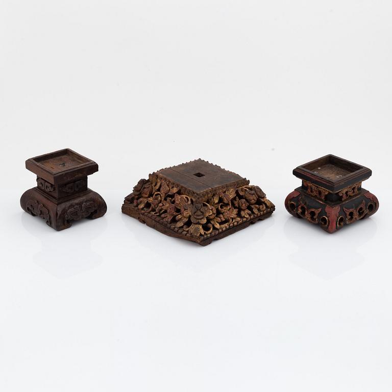 A set of three carved wooden stands, early 20th Century.