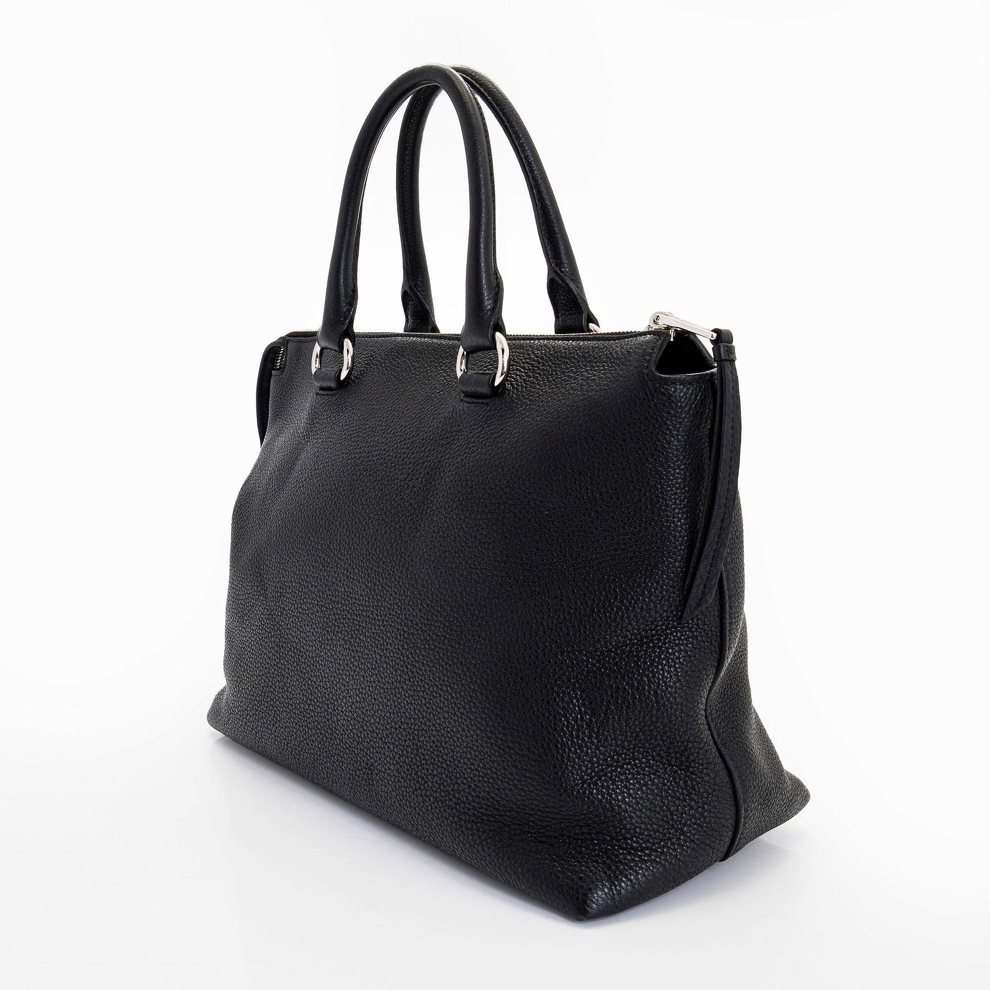 Prada, a leather bag.