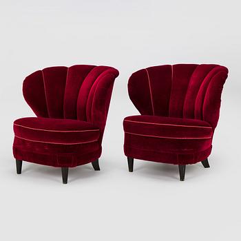 A pair of mid-20th century armchairs.