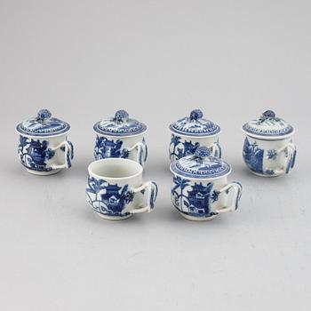 A set of six blue and white custard cups with covers,