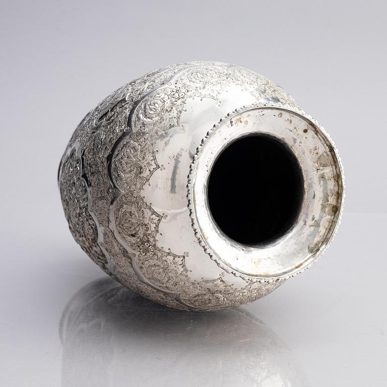 A Persian silver vase, late Qajar dynasty around 1910.