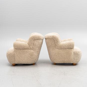 A pair of Swedish Modern armchairs, mid-20th Century.