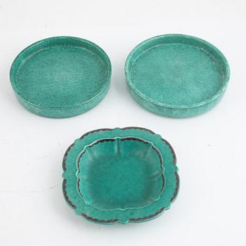 Wilhelm Kåge and Josef Ekberg, ten pieces of green glazed stoneware, Sweden, mid 20th century.