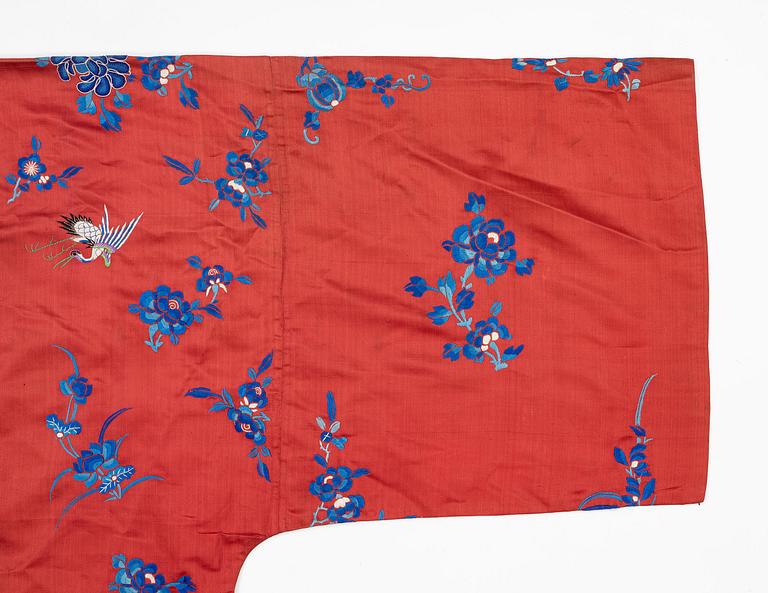 A Chinese semi-formal embroidered silk robe, late Qing dynasty, circa 1900.