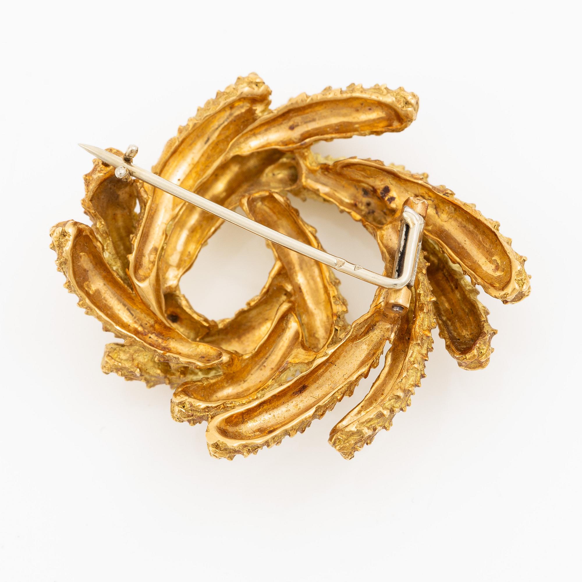 Brosch Hermès 18K guld i form av krans.