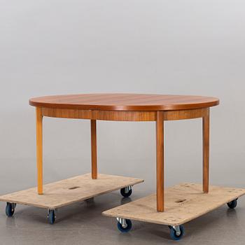 A mid 20th century teak dining table.