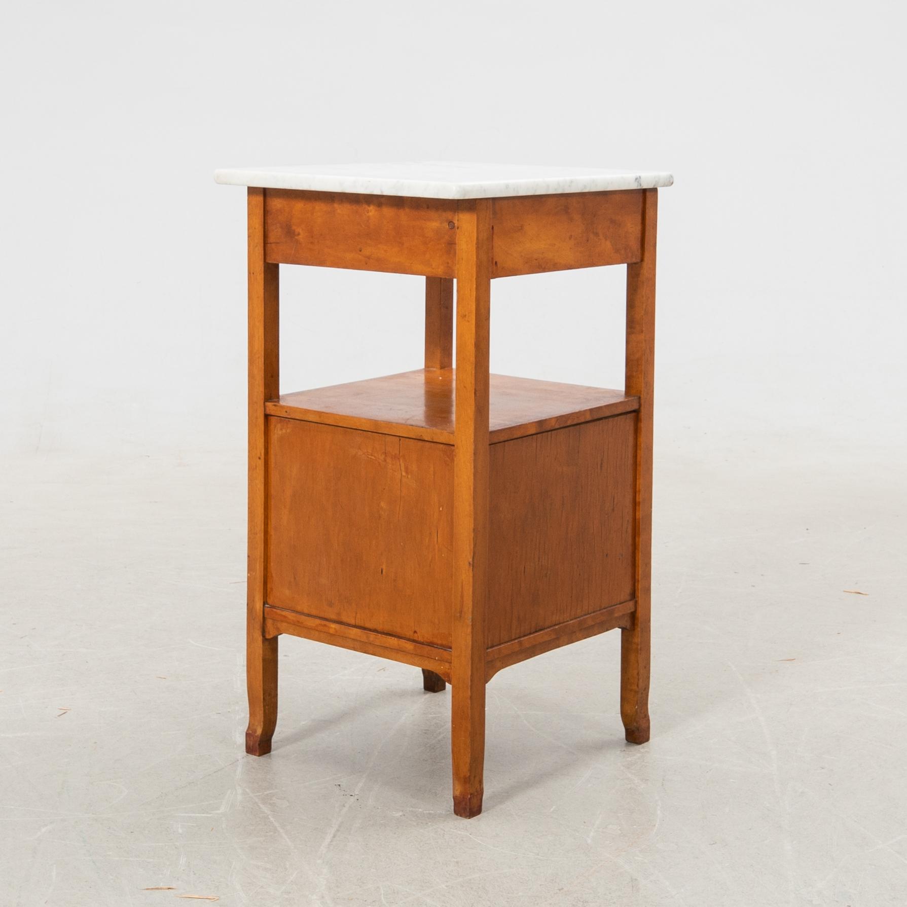 Bedside table with marble top, 20th century.