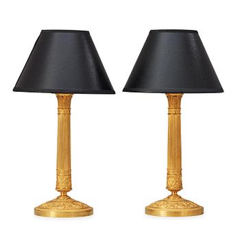 1446. A pair of French Empire 19th century gilt bronze table lamps.