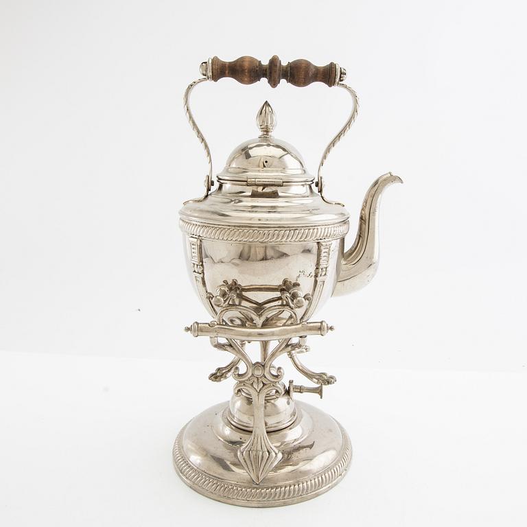 Tea kettle with a burner around 1900.