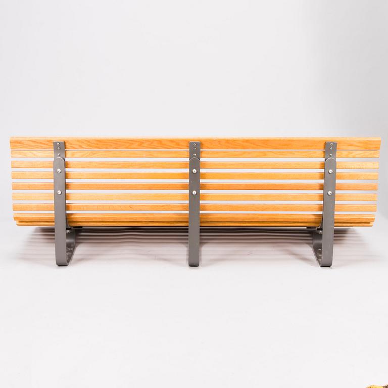 OLLE ANDERSON, A Swedish wall mounted wooden bench manufactured by Nola in the 2000s.