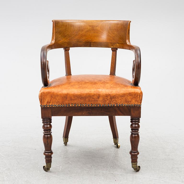 An Empire armchair, 19th century.