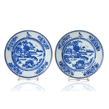 1331. A pair of blue and white soft paste armorial dishes, Qing dynasty, Qianlong (1736-95).