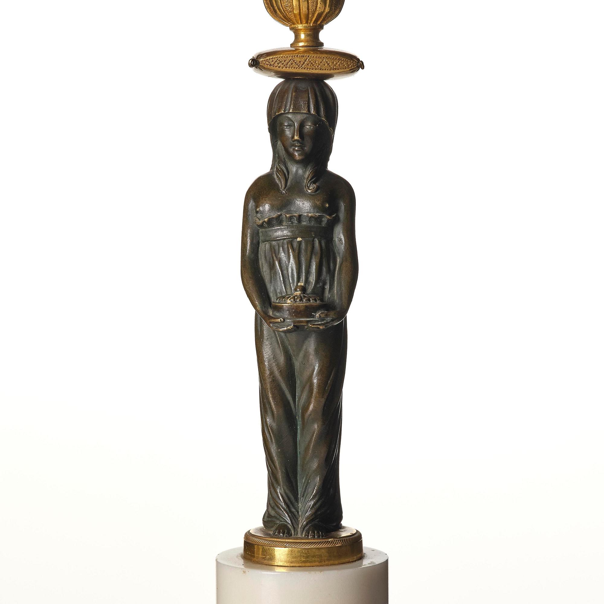 A pair of late Gustavian white marble and bronze candelabra.
