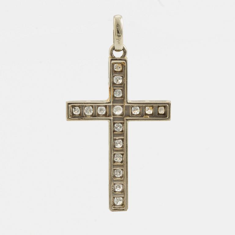 White gold and brilliant cut diamond cross pendant.