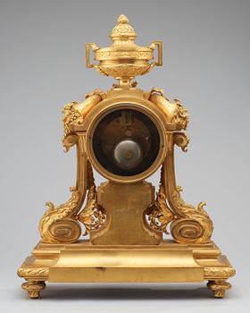 A Louis XVI-style late 19th Century gilt bronze mantel clock.