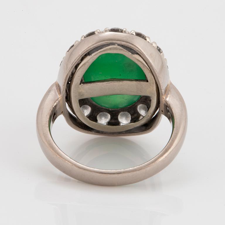 A jade and round brilliant-cut diamonds with a total weight of circa 0.60 ct.